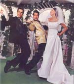 Jesse Garon dancing with the bride and groom