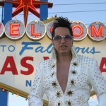 Elvis and Vegas tourists visiting the famous Las Vegas sign